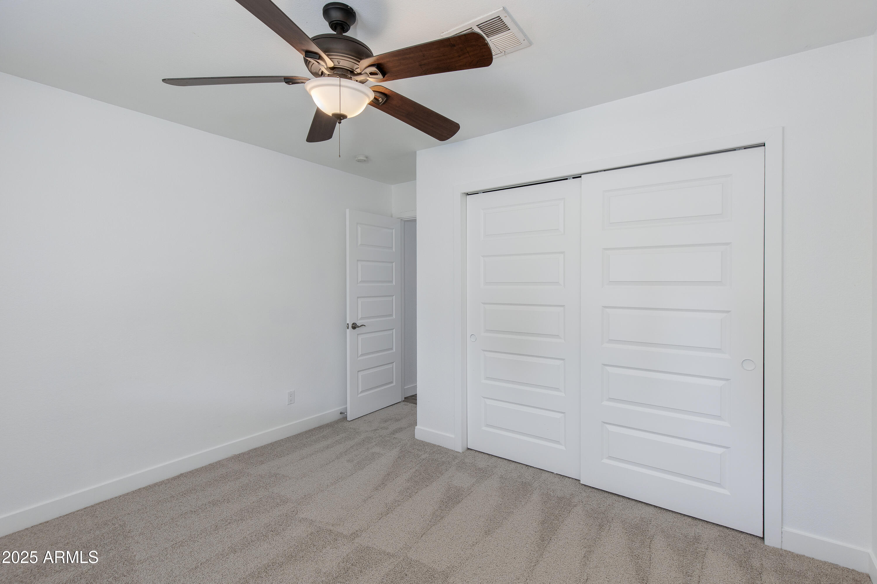 1820 West Seldon Way Phoenix, AZ 85021 - Photo 17 of 29 an empty room with a ceiling fan and a ceiling fan