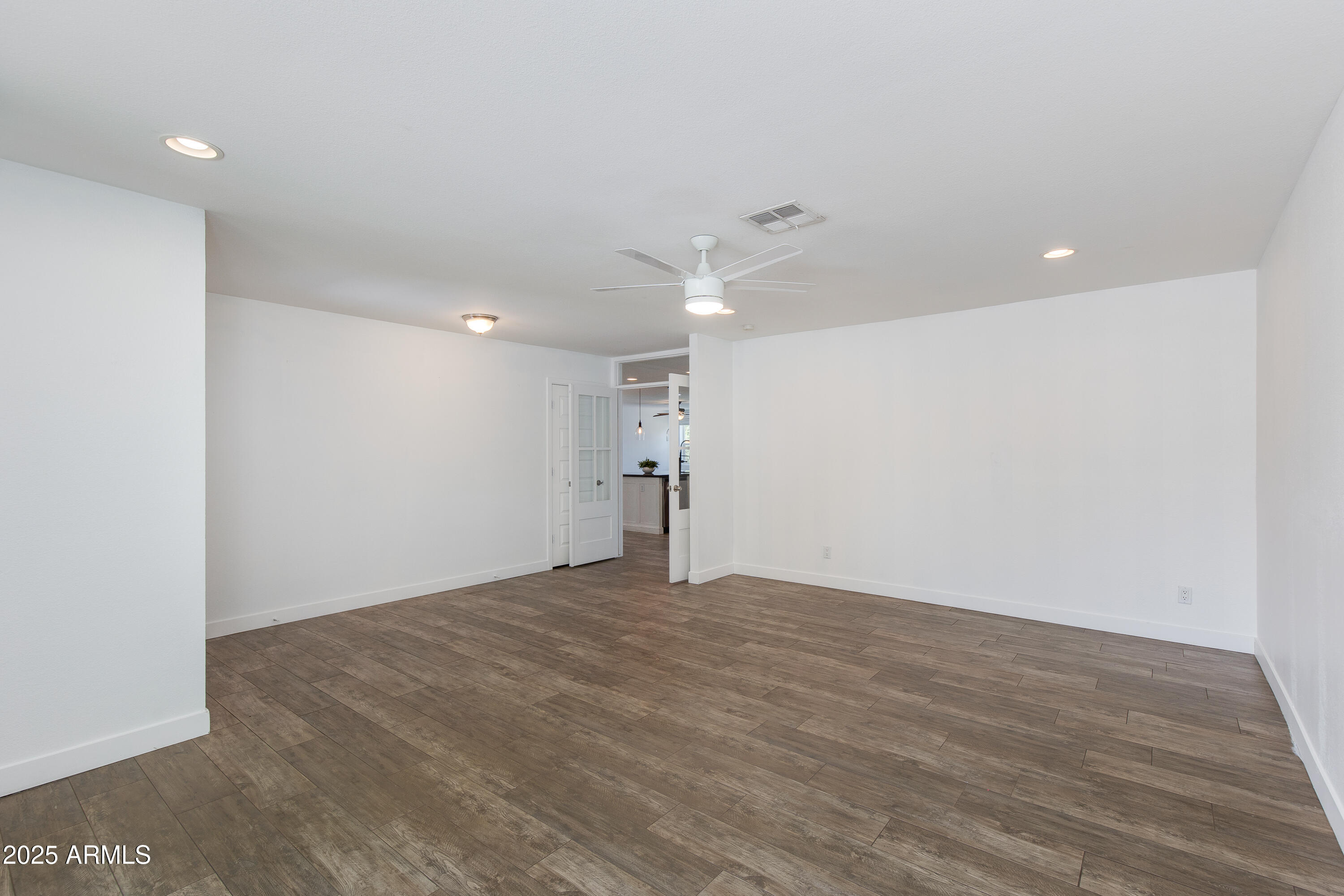 1820 West Seldon Way Phoenix, AZ 85021 - Photo 3 of 29 a view of empty room with wooden floor