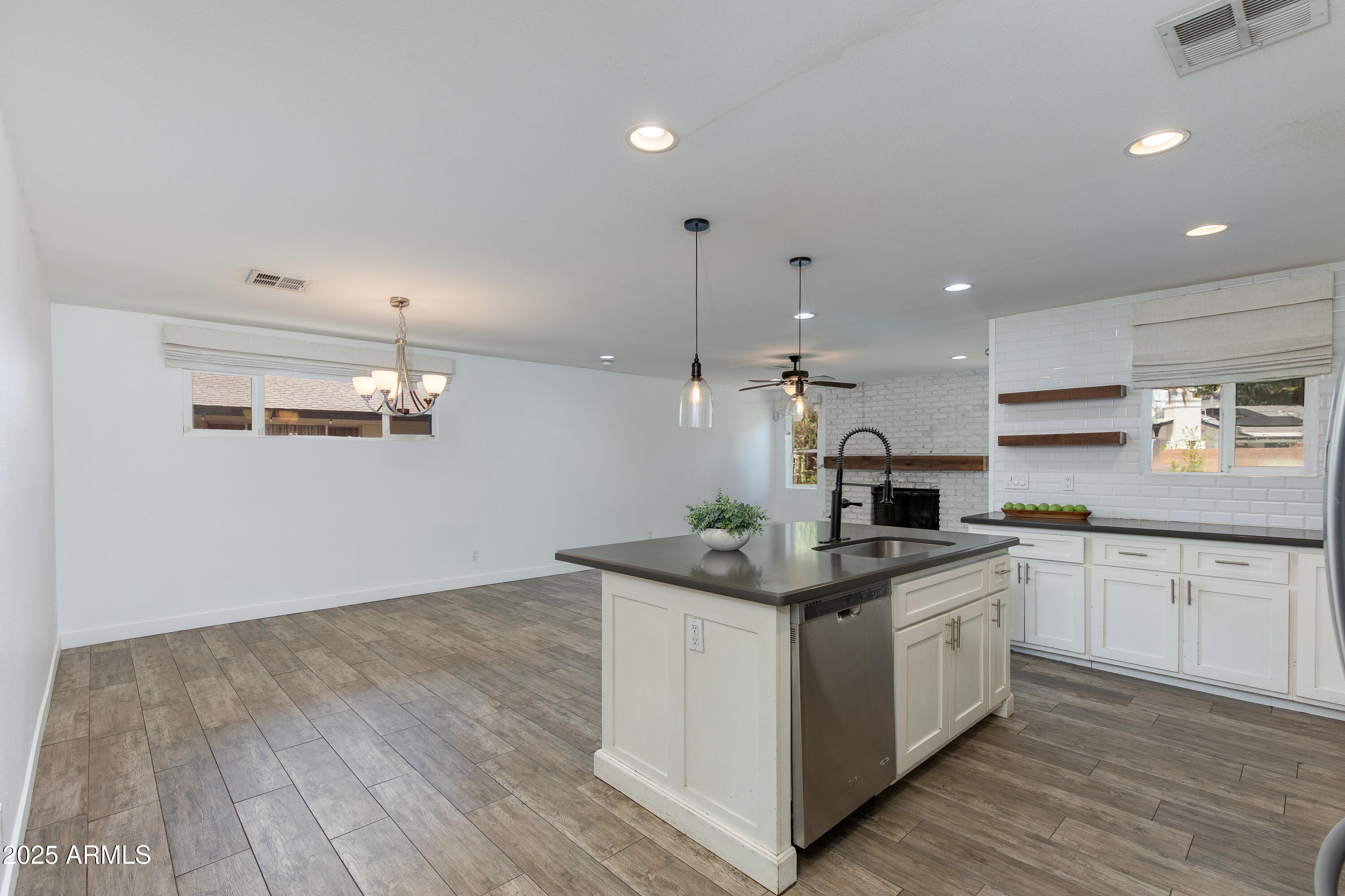 1820 West Seldon Way Phoenix, AZ 85021 - Photo 5 of 29 a kitchen with a sink window and cabinets