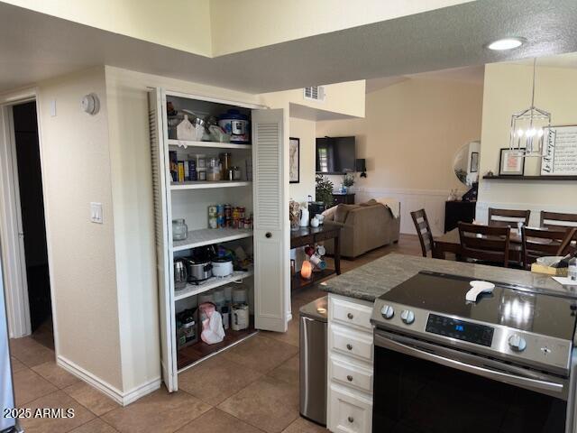 18235 North 45th Avenue Glendale, AZ 85308 - Photo 12 of 39 a kitchen with a stove and cabinets