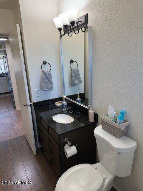 18235 North 45th Avenue Glendale, AZ 85308 - Photo 17 of 39 a bathroom with a toilet sink and mirror