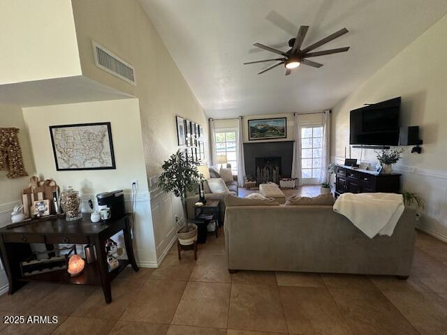 18235 North 45th Avenue Glendale, AZ 85308 - Photo 3 of 39 a living room with furniture a fireplace and a flat screen tv