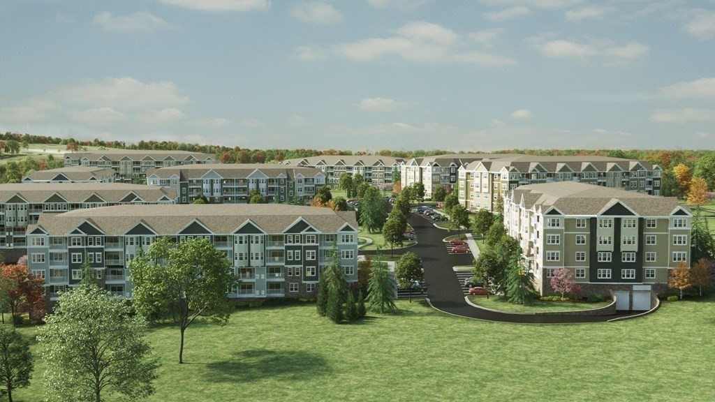1 Codman Way, Unit 403 Westborough, MA 01581 - Photo 21 of 35 a view of a house with a big yard and potted plants