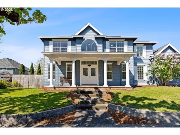 front view of a house with a yard