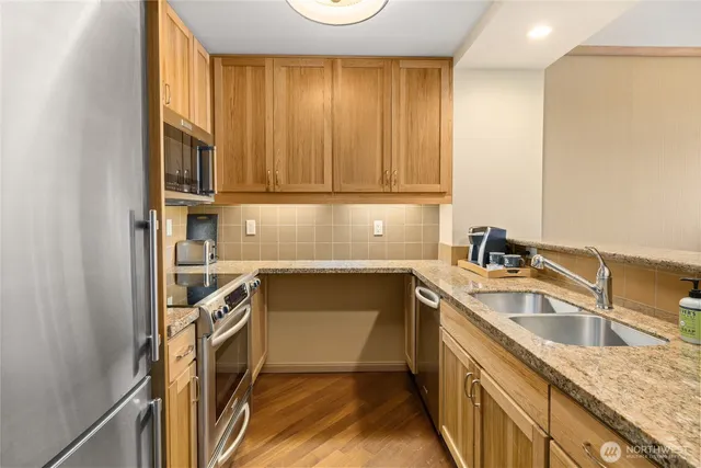 a kitchen with a sink and cabinets