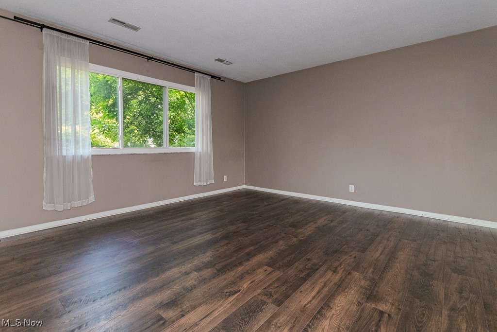 2969 Gale Road Willoughby, OH 44094 - Photo 31 of 46 Unfurnished room featuring dark wood-style flooring and baseboards