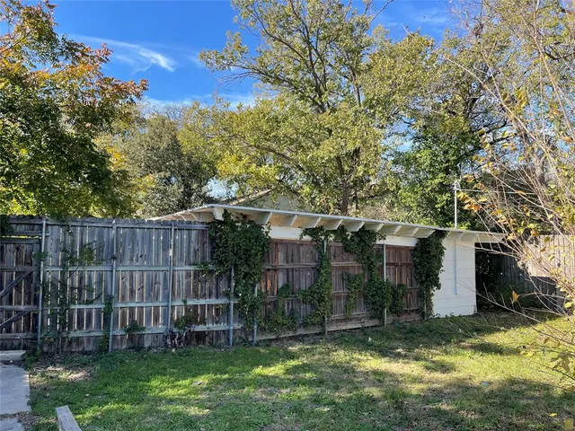 a view of a house with snow in front of house