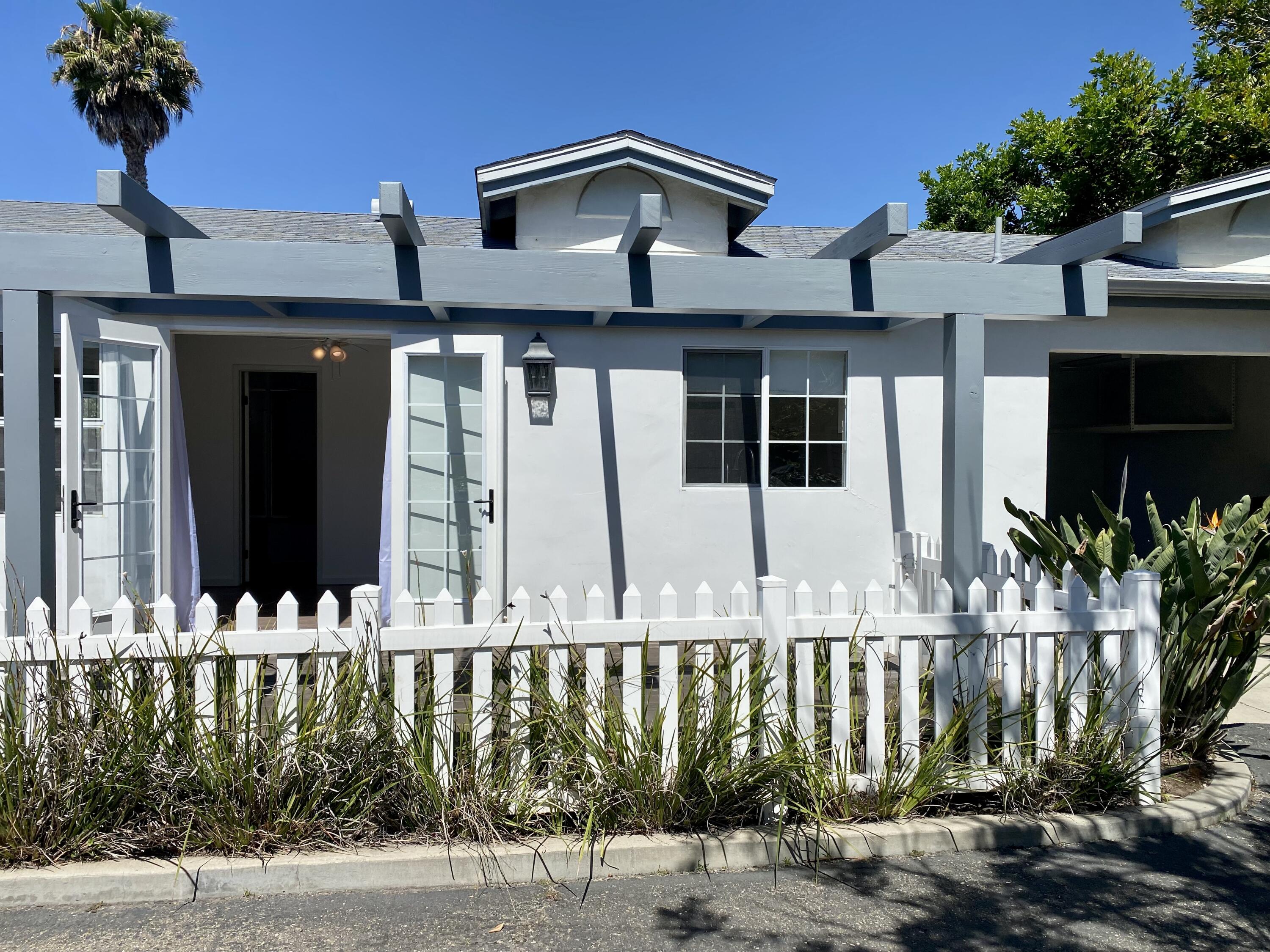 4854 8th Street Carpinteria, CA 93013 - Photo 12 of 22 a front view of a house with street