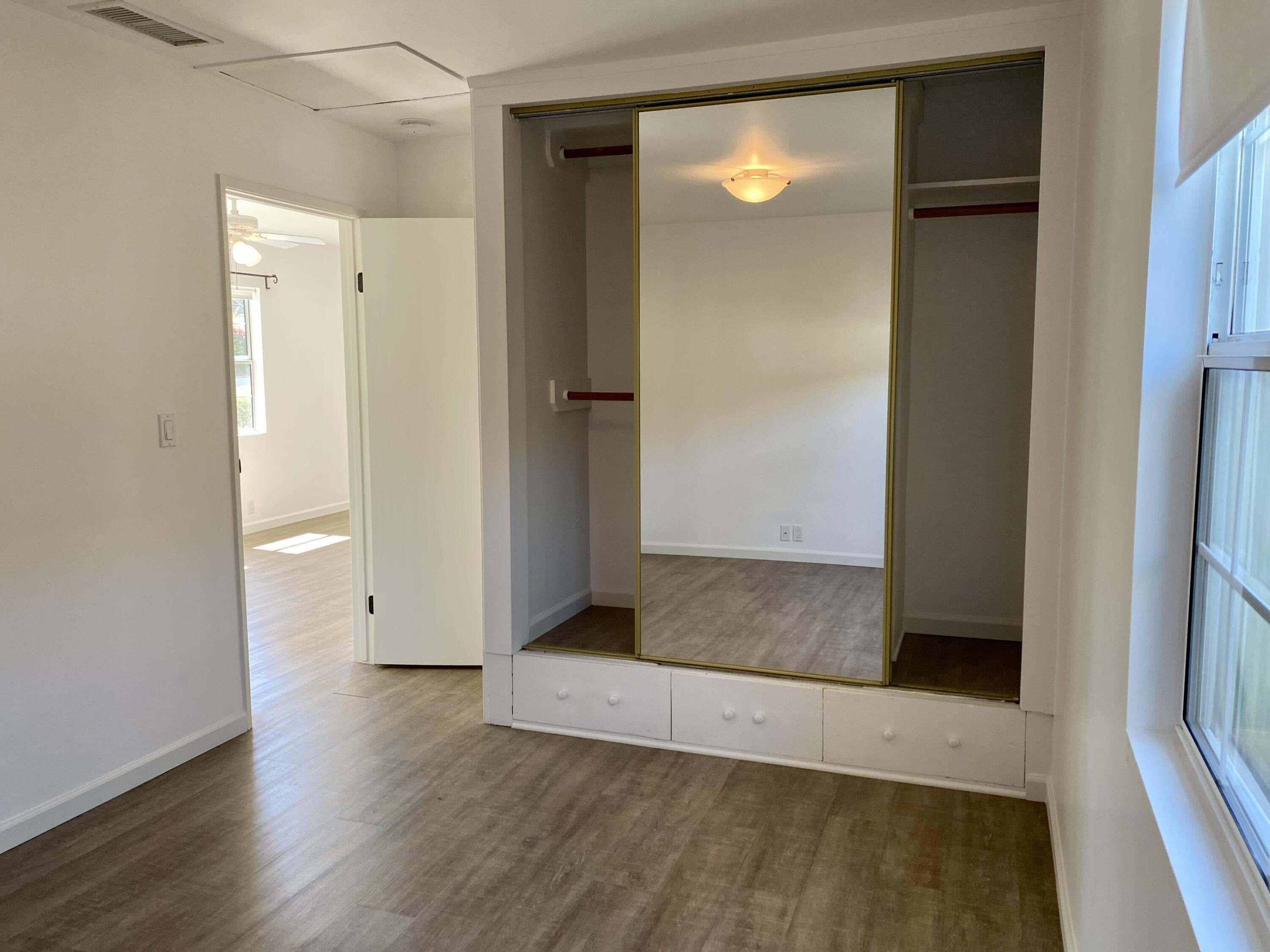 4854 8th Street Carpinteria, CA 93013 - Photo 15 of 22 an empty room with wooden floor and entrance