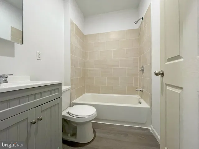 a bathroom with a sink a toilet and a bathtub