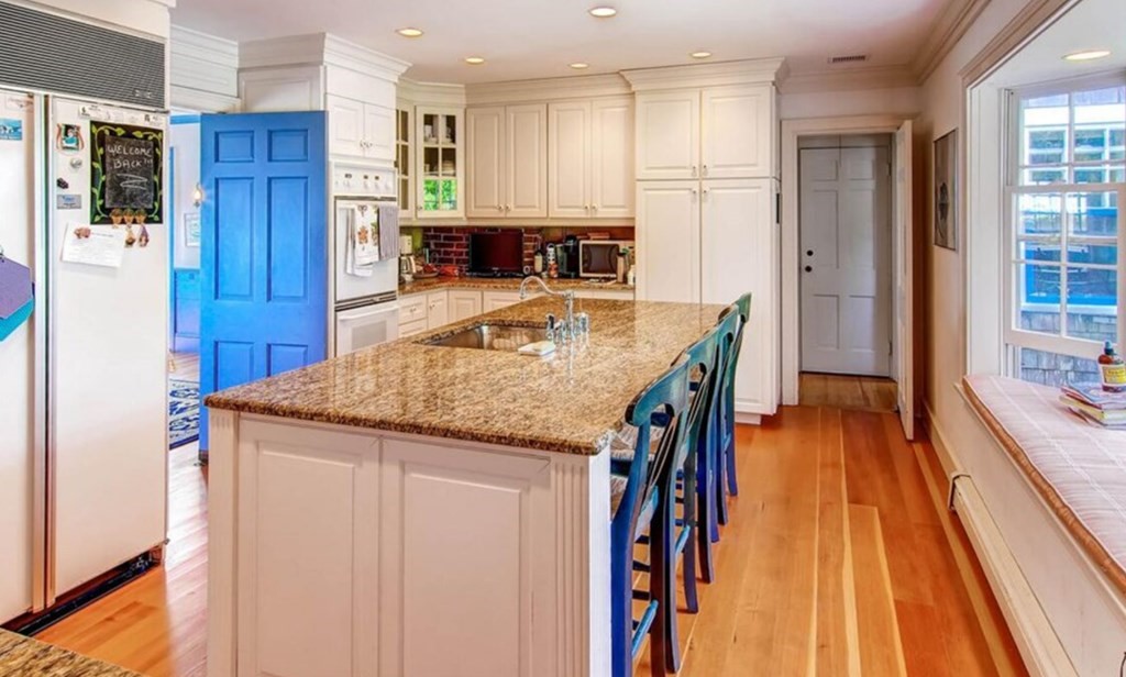 5 Wauompauque Trail, Unit 1 CH213 Chilmark, MA 02535 - Photo 2 of 8 a kitchen with stainless steel appliances granite countertop a refrigerator and a stove top oven