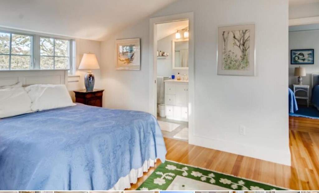 5 Wauompauque Trail, Unit 1 CH213 Chilmark, MA 02535 - Photo 7 of 8 a bedroom with a bed and a view of living room