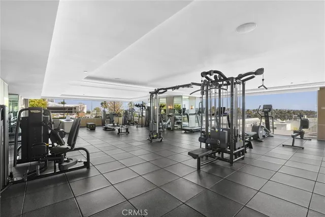 a living room with furniture and chandelier