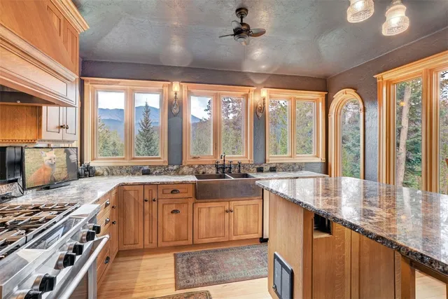 a large kitchen with a large window and a counter space