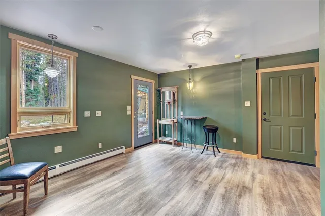 a view of a room with furniture window and wooden floor