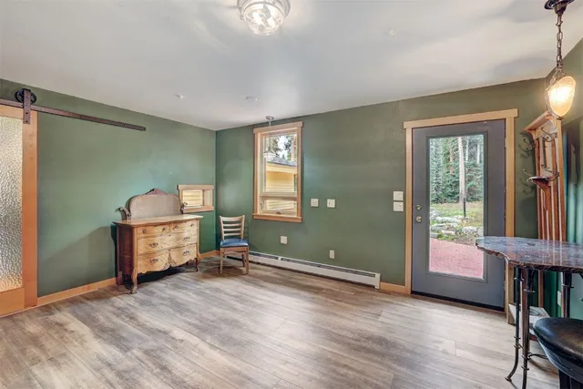 a view of a livingroom with furniture and windows
