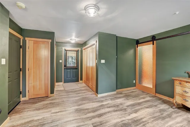 a view of a bathroom with shower and windows