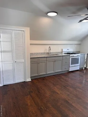a view of a kitchen with a sink and dishwasher