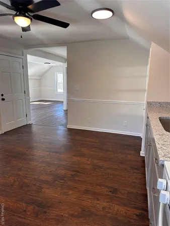 a view of a livingroom with wooden floor