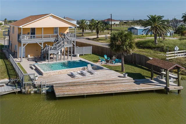 a aerial view of a house with swimming pool