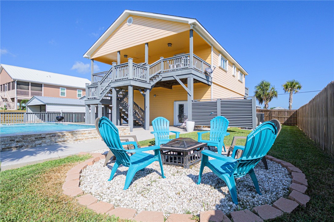 102 Ball Street Rockport, TX 78382 - Photo 11 of 40 a view of a chair and table in backyard