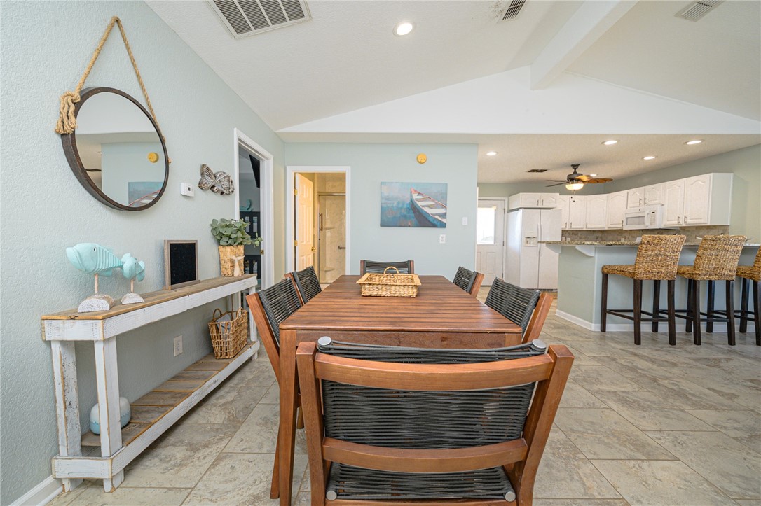 102 Ball Street Rockport, TX 78382 - Photo 23 of 40 a dining room with a table and chairs in it