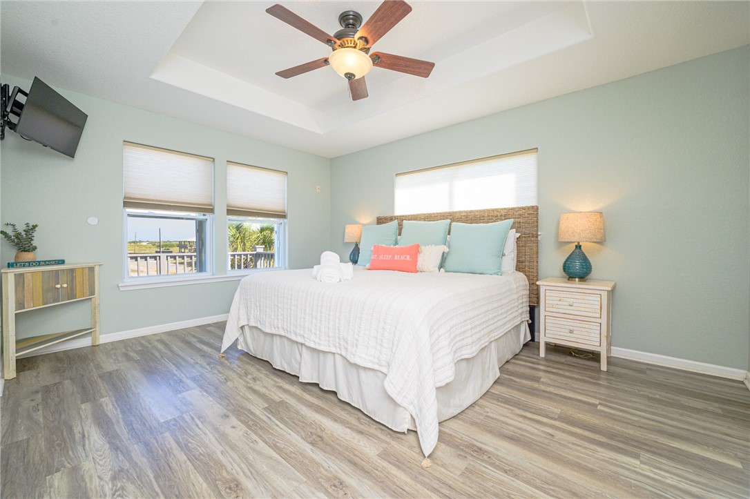 102 Ball Street Rockport, TX 78382 - Photo 27 of 40 a bedroom with a bed and a window