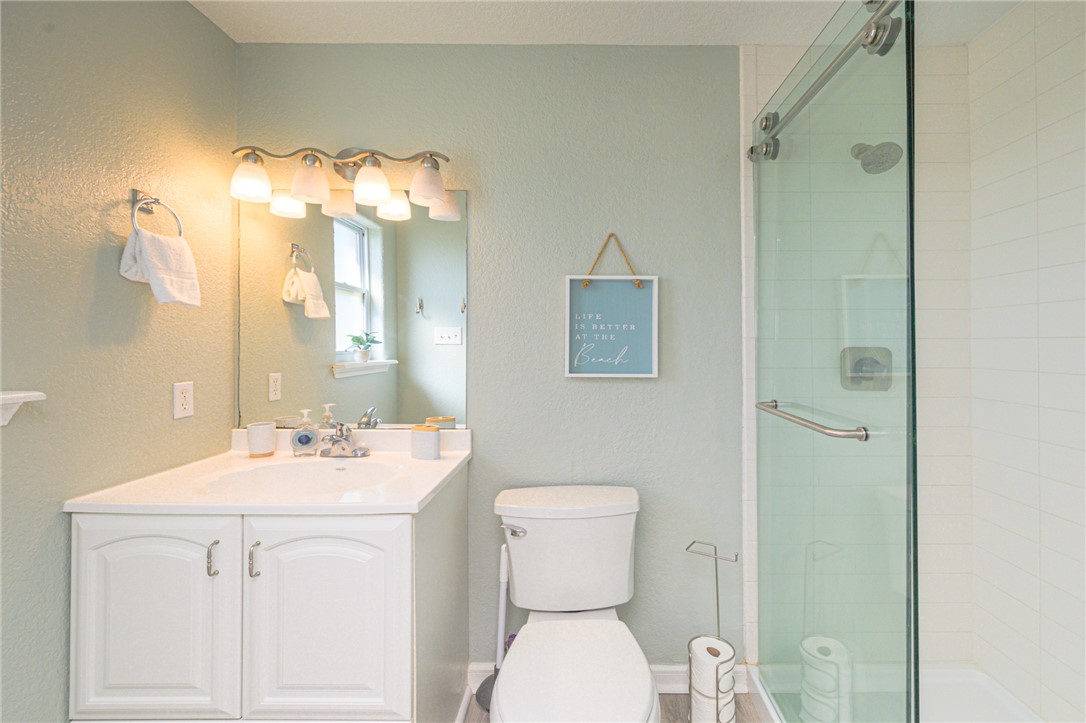 102 Ball Street Rockport, TX 78382 - Photo 29 of 40 a bathroom with a sink toilet and shower