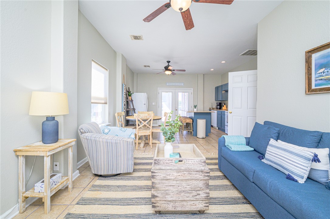 102 Ball Street Rockport, TX 78382 - Photo 36 of 40 a living room with furniture and a chandelier