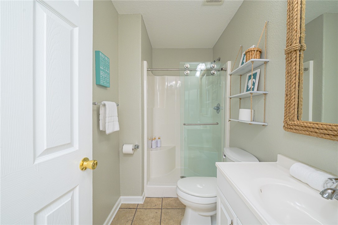 102 Ball Street Rockport, TX 78382 - Photo 38 of 40 a bathroom with a sink a toilet and shower