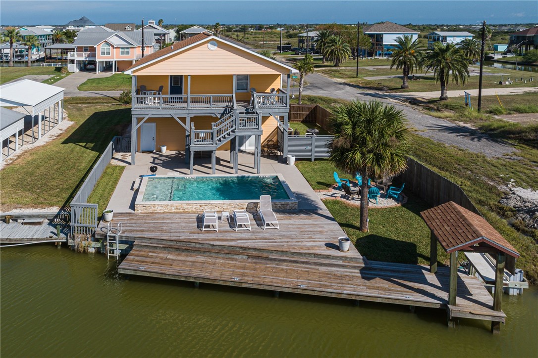 102 Ball Street Rockport, TX 78382 - Photo 4 of 40 a view of swimming pool with outdoor seating and yard