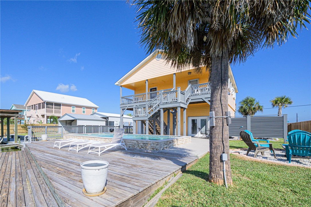 102 Ball Street Rockport, TX 78382 - Photo 10 of 40 a view of a house with a swimming pool