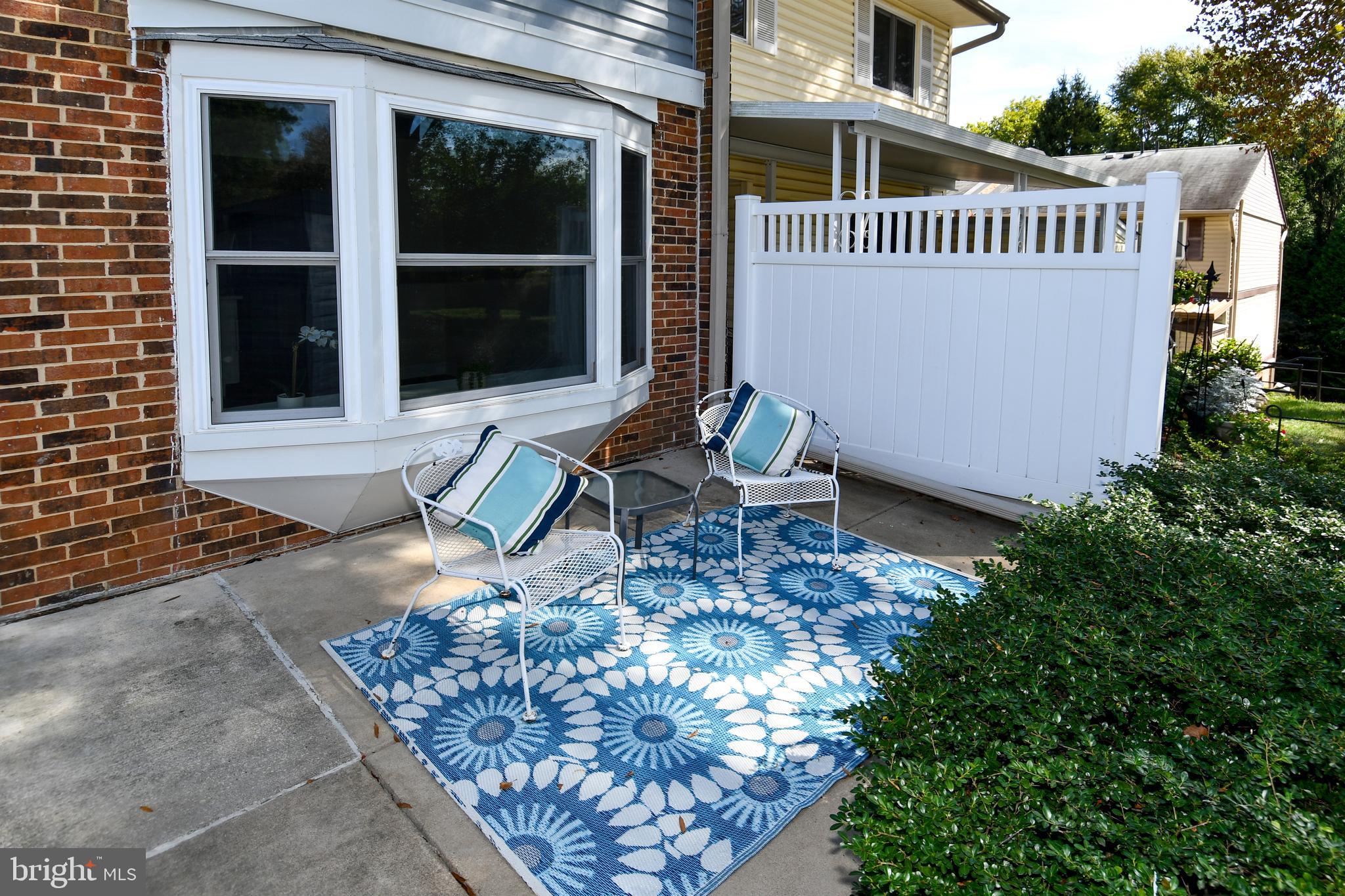 15003 Candover Court, Unit 281C Silver Spring, MD 20906 - Photo 3 of 42 a view of a house with backyard and sitting area