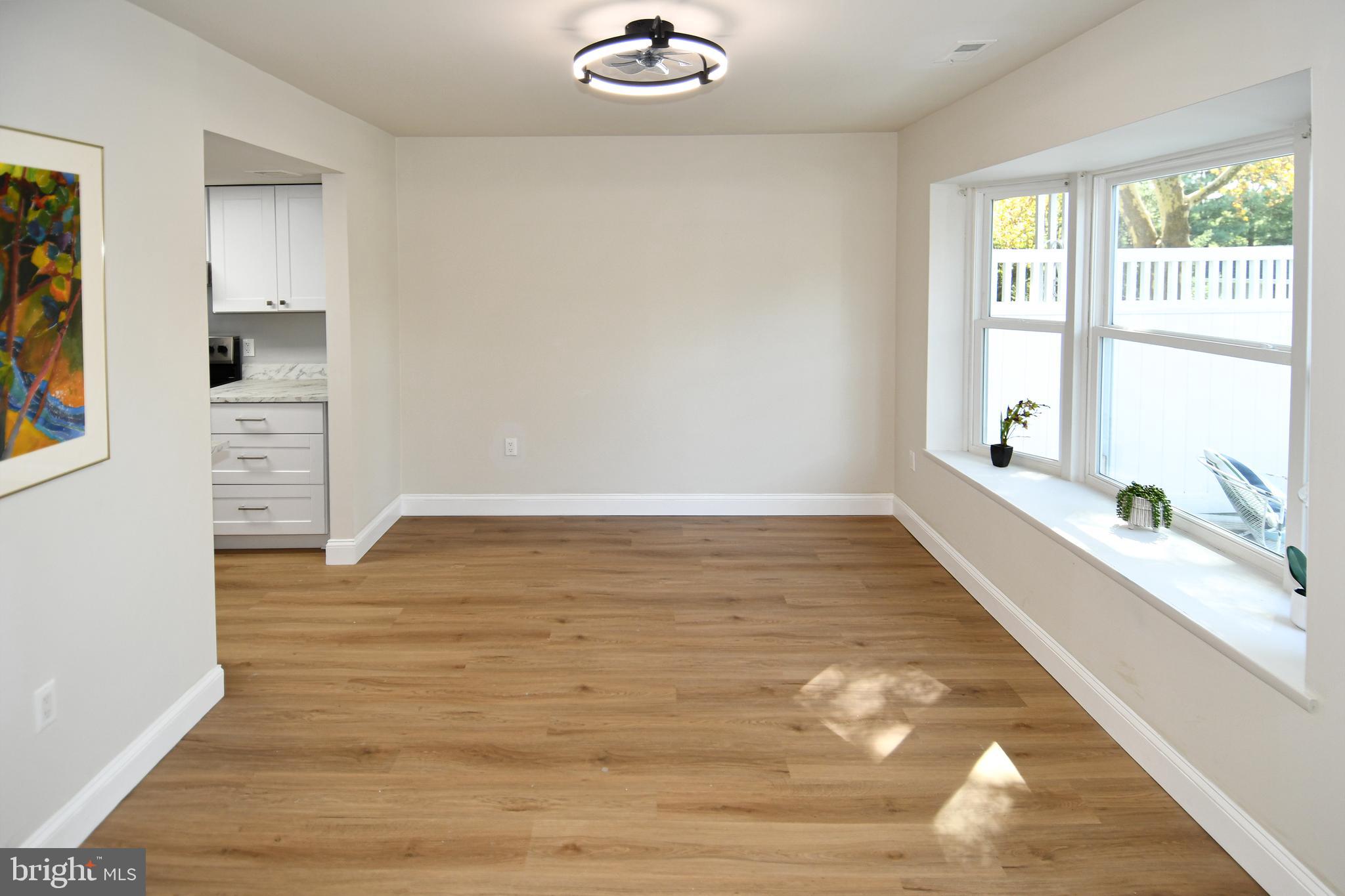 15003 Candover Court, Unit 281C Silver Spring, MD 20906 - Photo 7 of 42 a view of empty room with wooden floor and fan