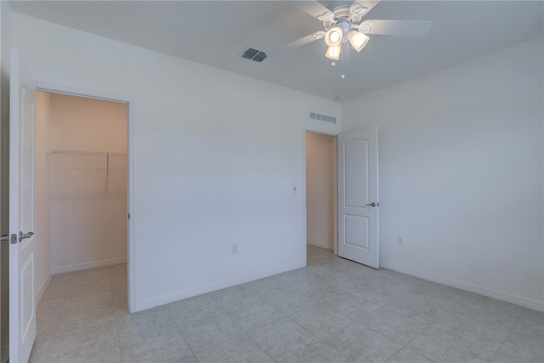 406 Easy Street Sebastian, FL 32958 - Photo 29 of 36 a view of an empty room with window chandelier fan