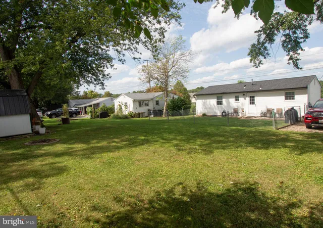 a view of a tree in front of a building