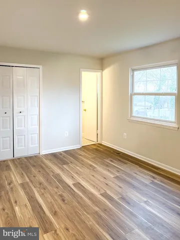 an empty room with a empty space and window