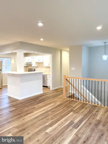 a view of a kitchen with a sink and a window