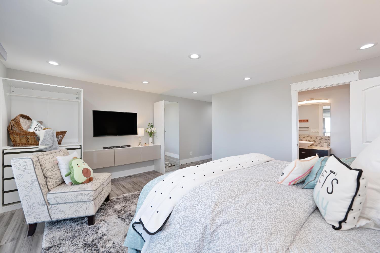 3468 Rolph Way El Dorado Hills, CA 95762 - Photo 21 of 51 a spacious bedroom with a bed and a flat screen tv