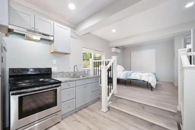 a kitchen with a stove and a sink