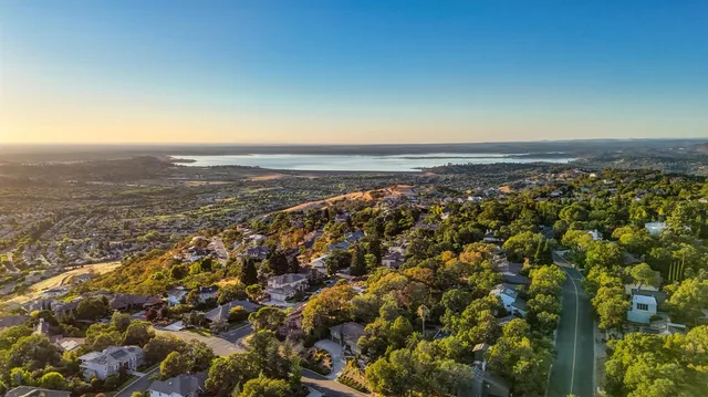 an aerial view of residential building and ocean