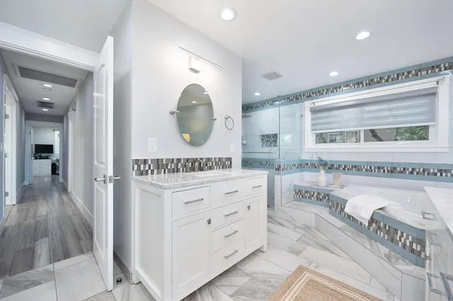 a view of a workspace with a flat screen tv and a window