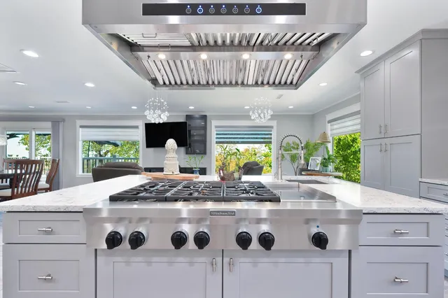 a kitchen with a stove a sink and a refrigerator