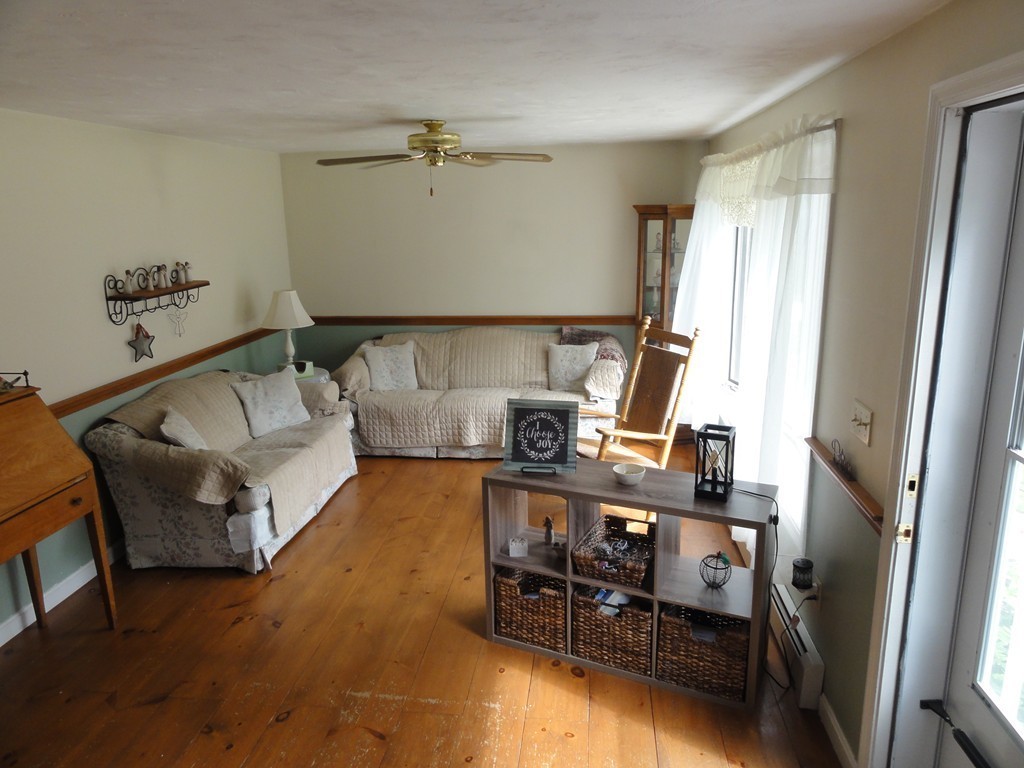 60 Walker Road, Unit 1 Shirley, MA 01464 - Photo 3 of 28 a living room with furniture and a flat screen tv