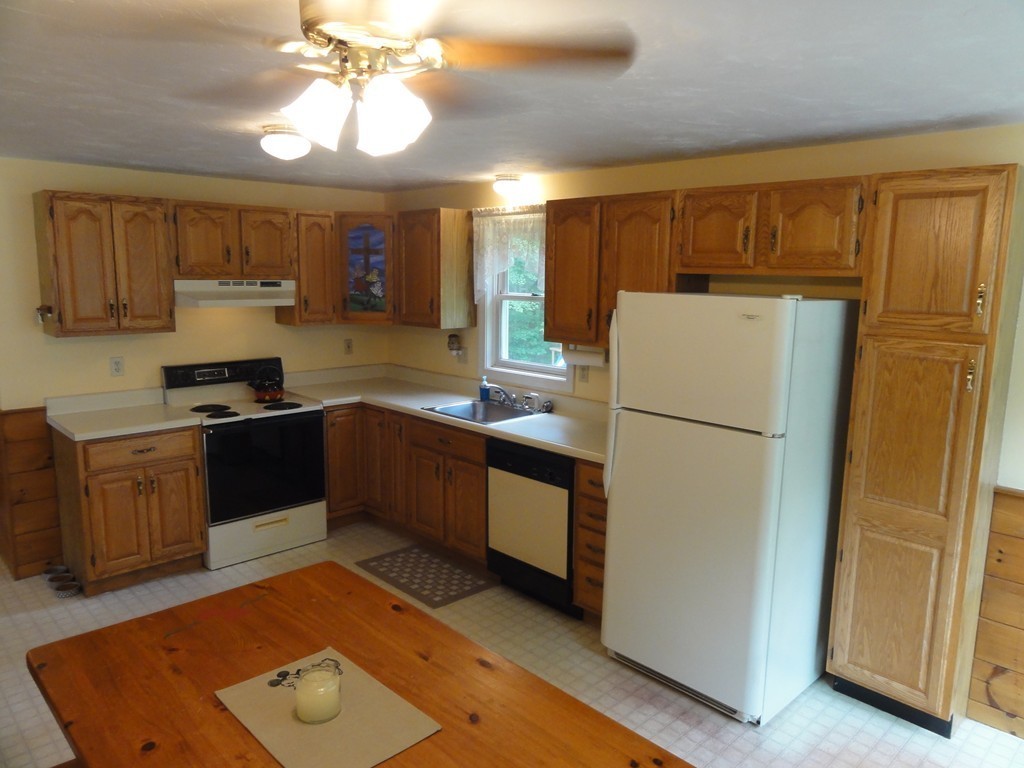 60 Walker Road, Unit 1 Shirley, MA 01464 - Photo 6 of 28 a kitchen with a refrigerator sink and cabinets