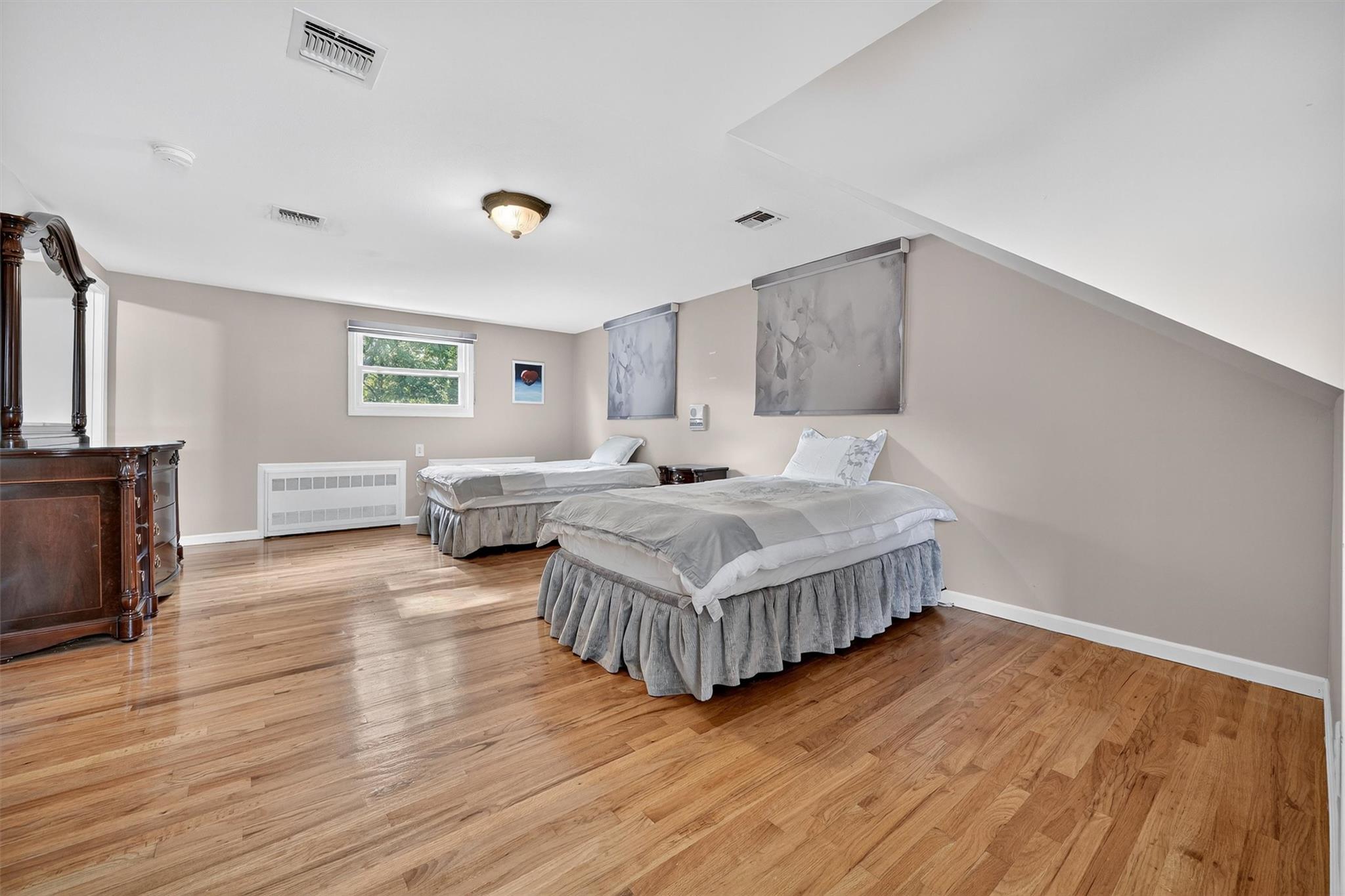 15 Dr Frank Road Spring Valley, NY 10977 - Photo 27 of 50 Bedroom featuring radiator and light wood-style flooring