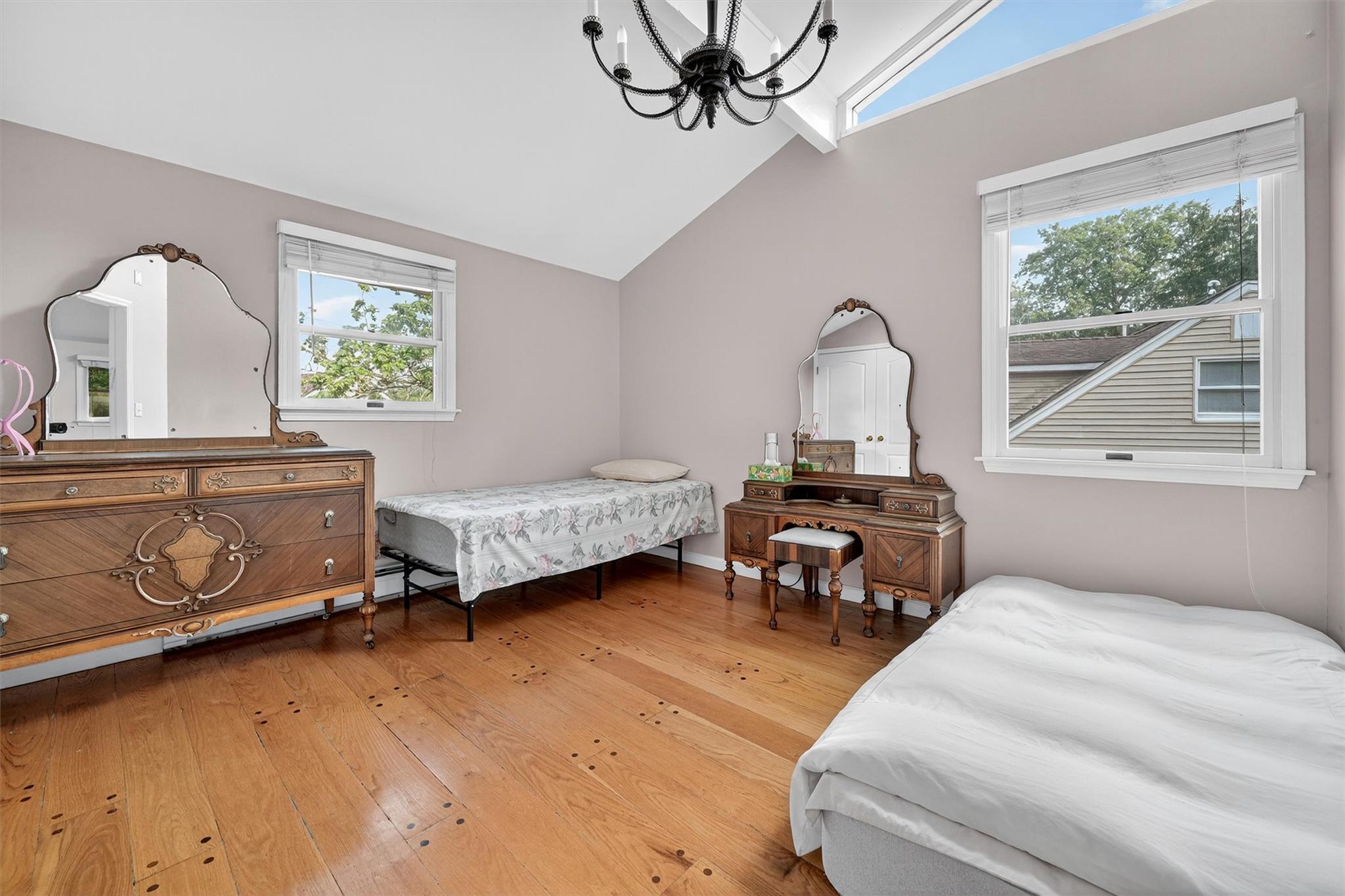 15 Dr Frank Road Spring Valley, NY 10977 - Photo 30 of 50 Bedroom with a chandelier, hardwood / wood-style flooring, and high vaulted ceiling