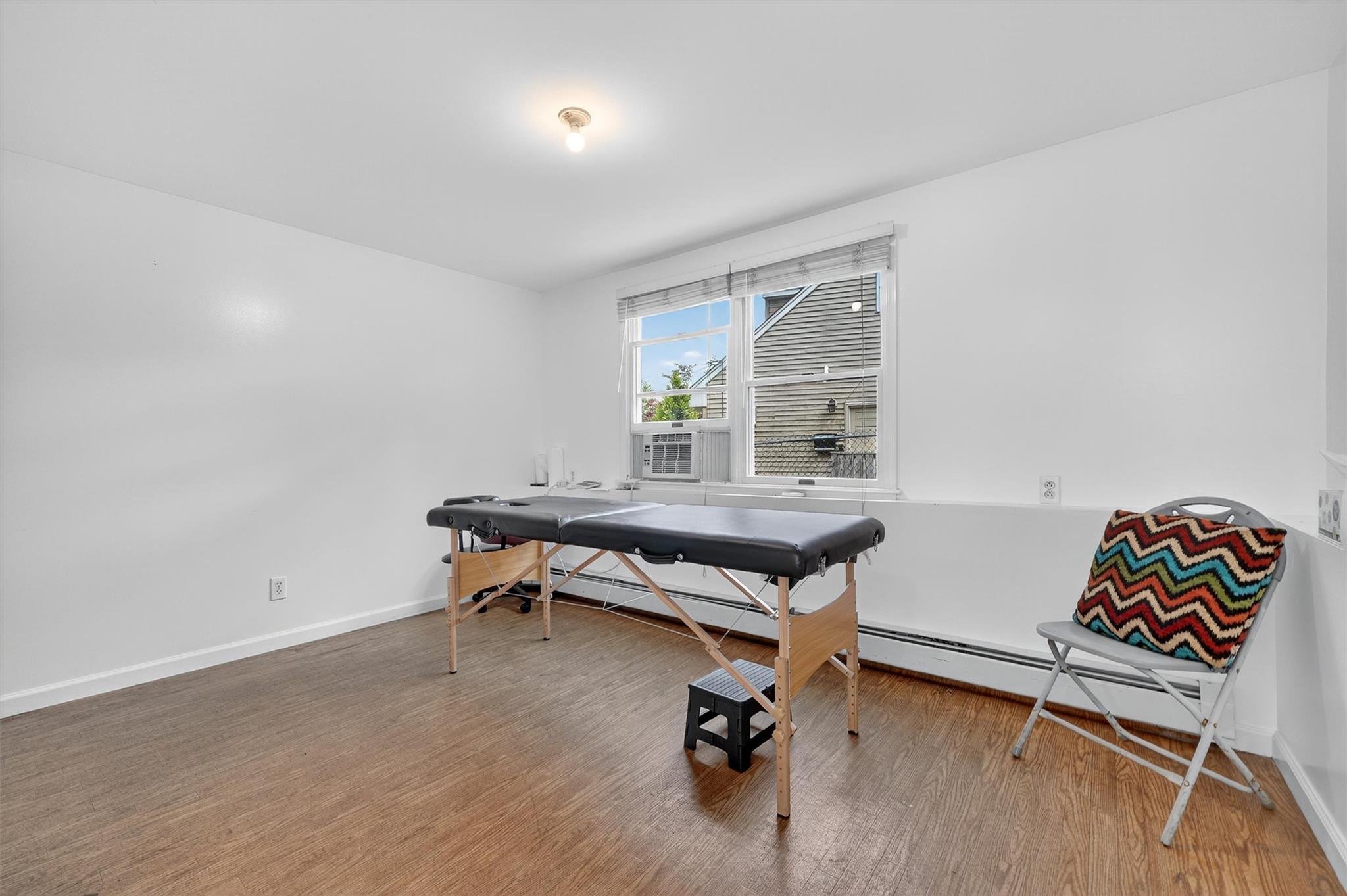 15 Dr Frank Road Spring Valley, NY 10977 - Photo 35 of 50 Recreation room with wood finished floors and cooling unit