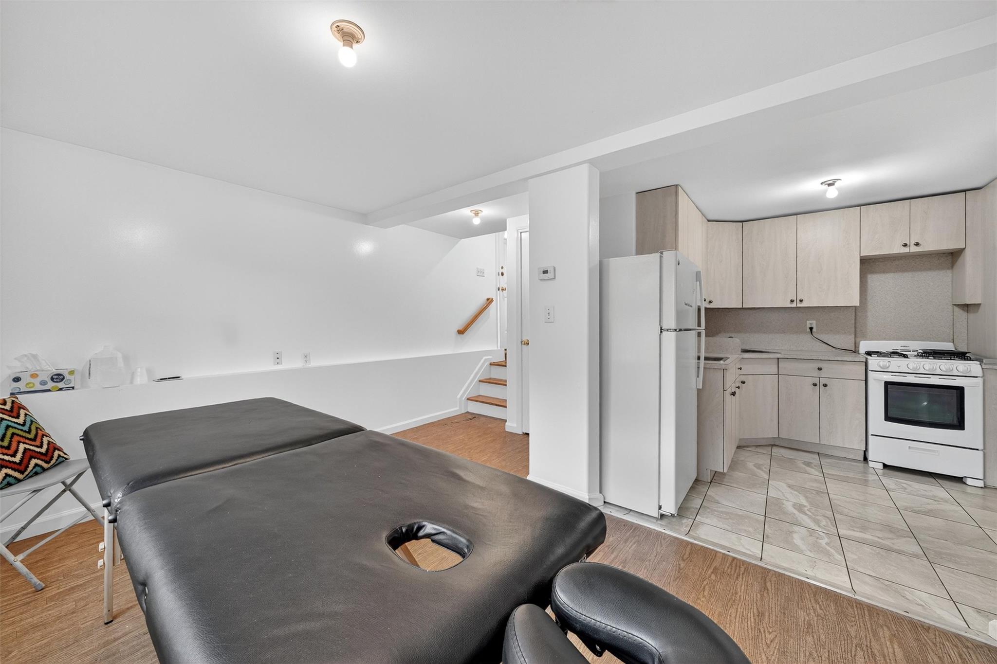 15 Dr Frank Road Spring Valley, NY 10977 - Photo 36 of 50 Kitchen with white appliances, light countertops, and light brown cabinetry