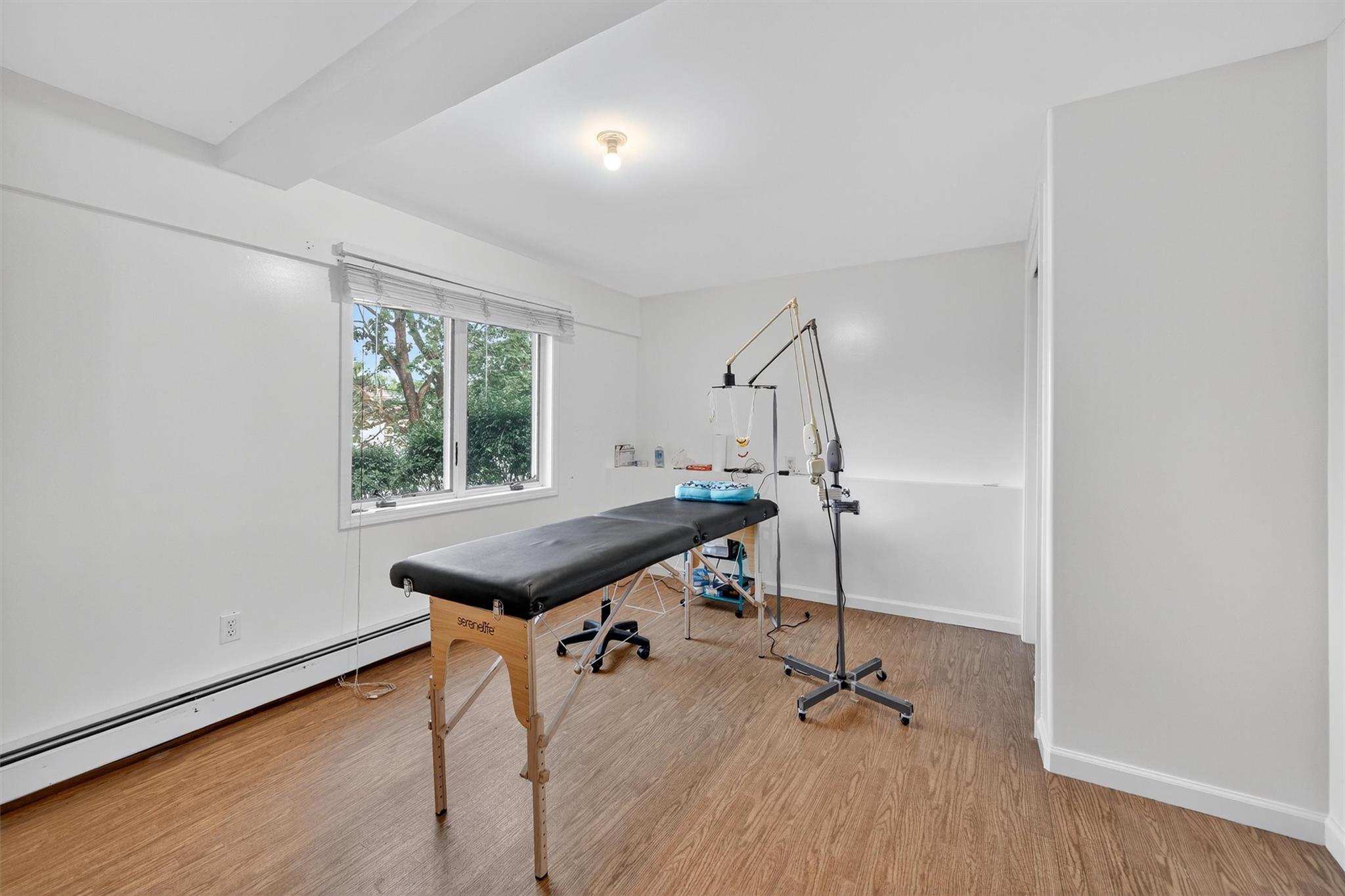 15 Dr Frank Road Spring Valley, NY 10977 - Photo 38 of 50 Home office with baseboard heating and wood finished floors